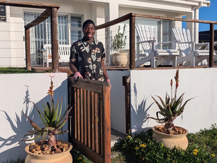 Franco standing proudly between landscaped garden pots
